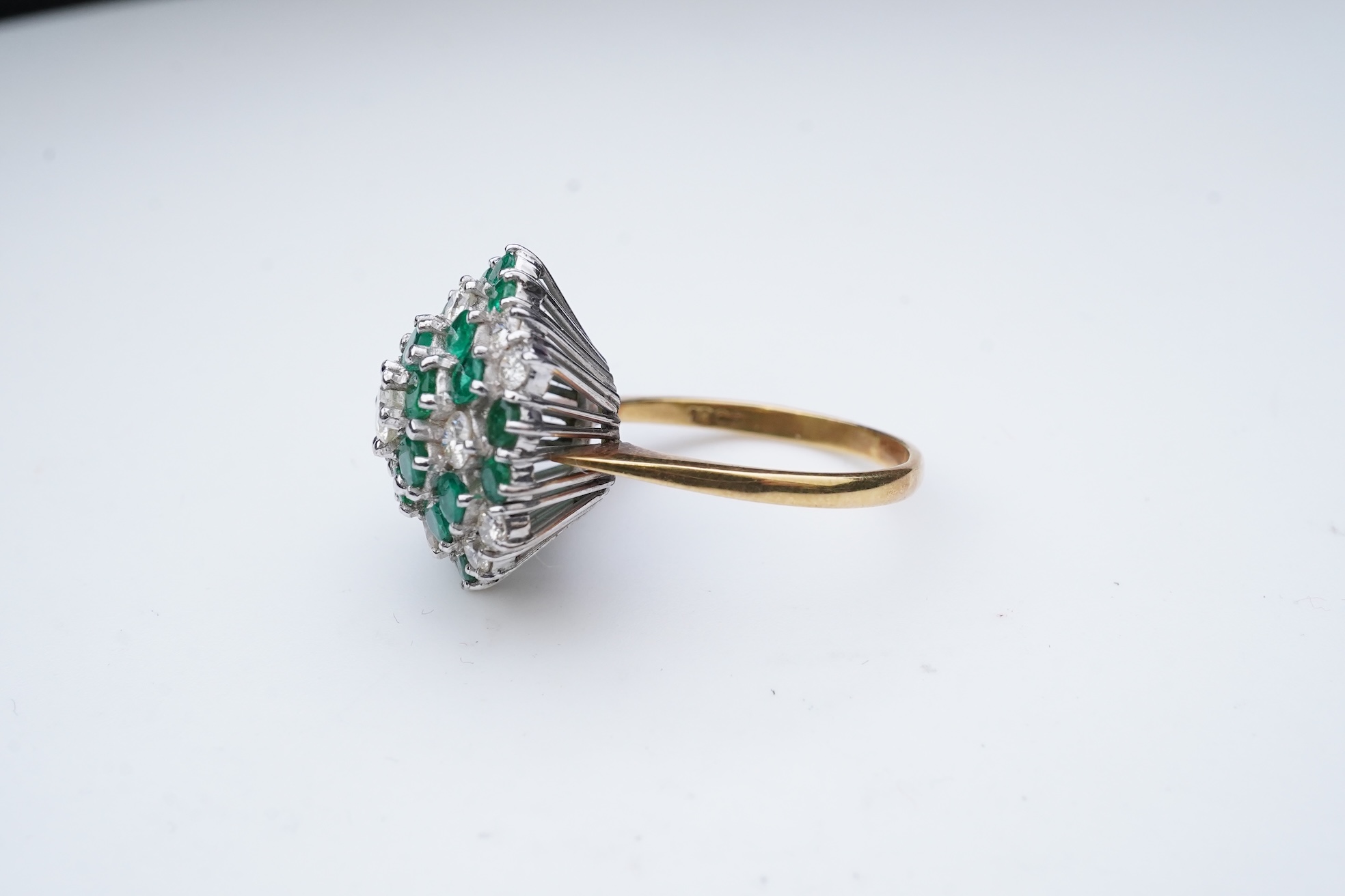 An emerald and diamond cocktail ring